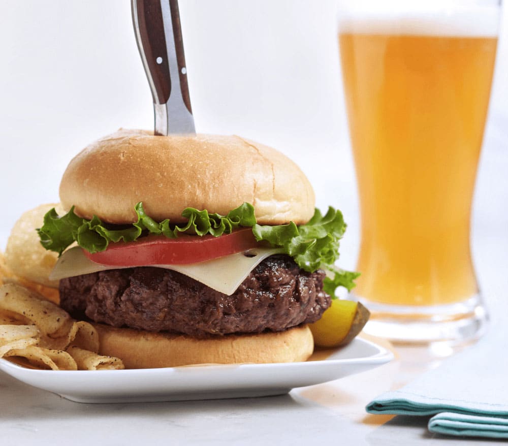 Wagyu thick burger in restaurant with beer