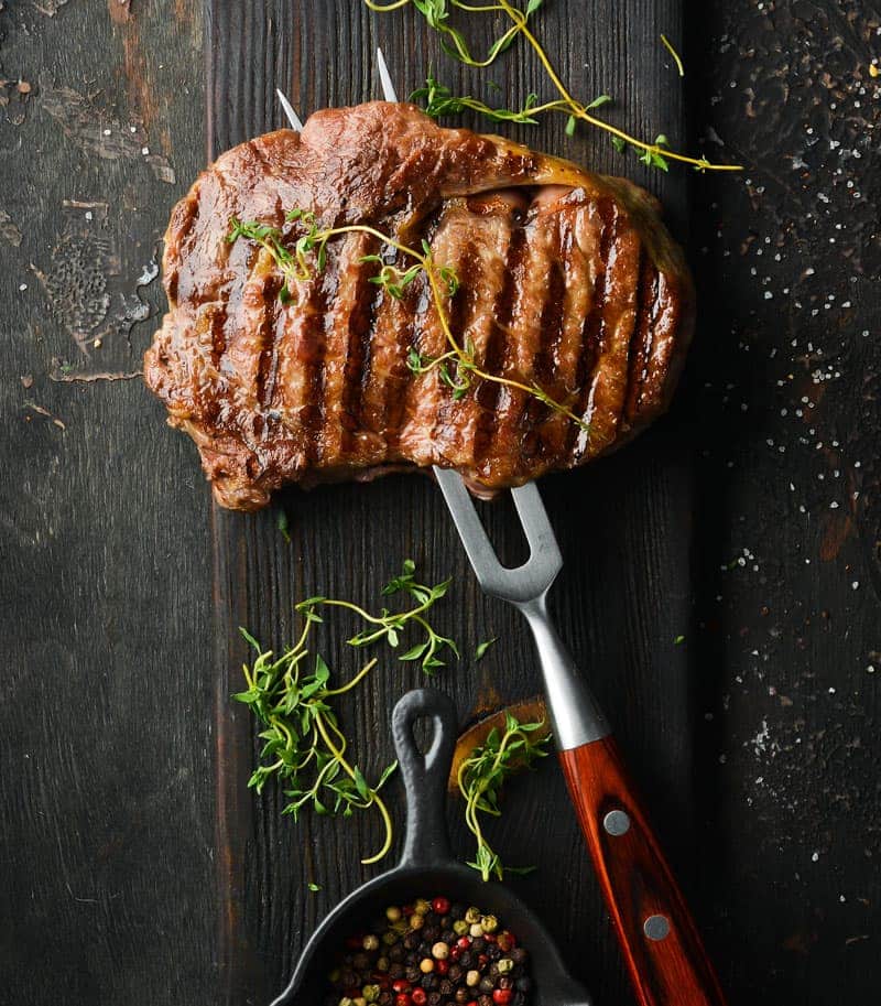 fork inside a wagyu ribeye steak