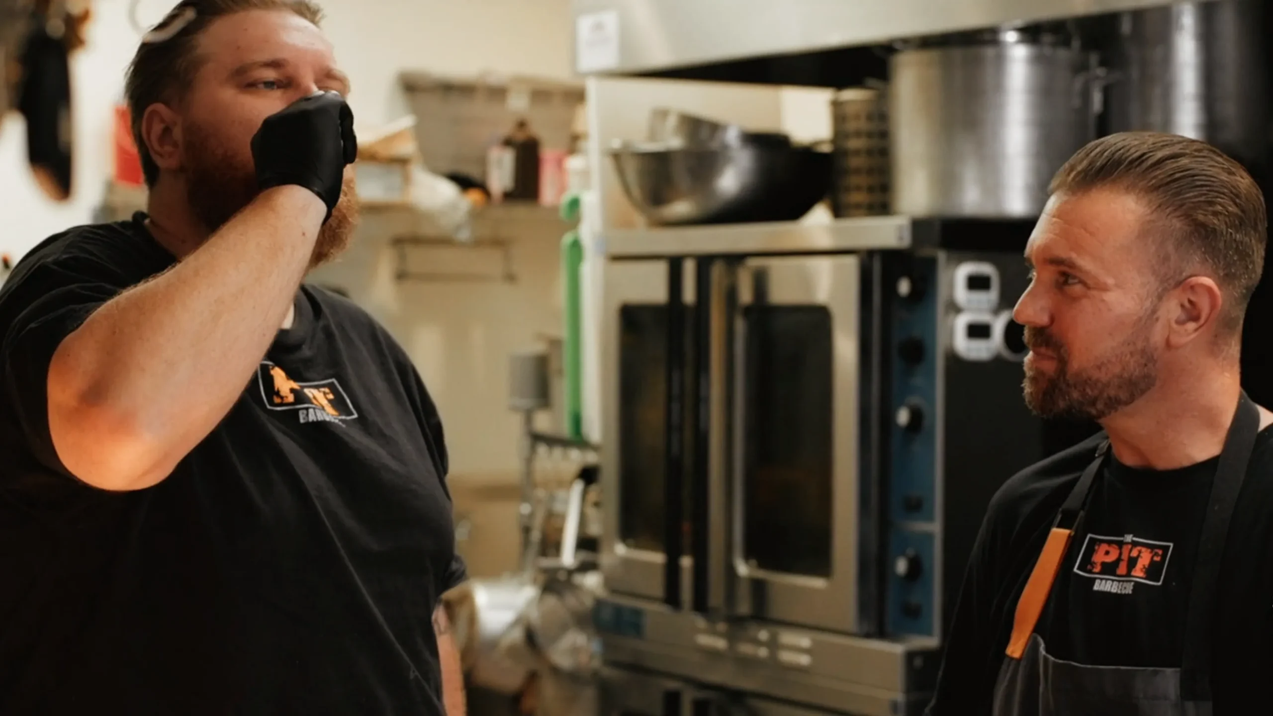 Chef Josh Holt and a member of the team at his restaurant, The Pit Barbecue