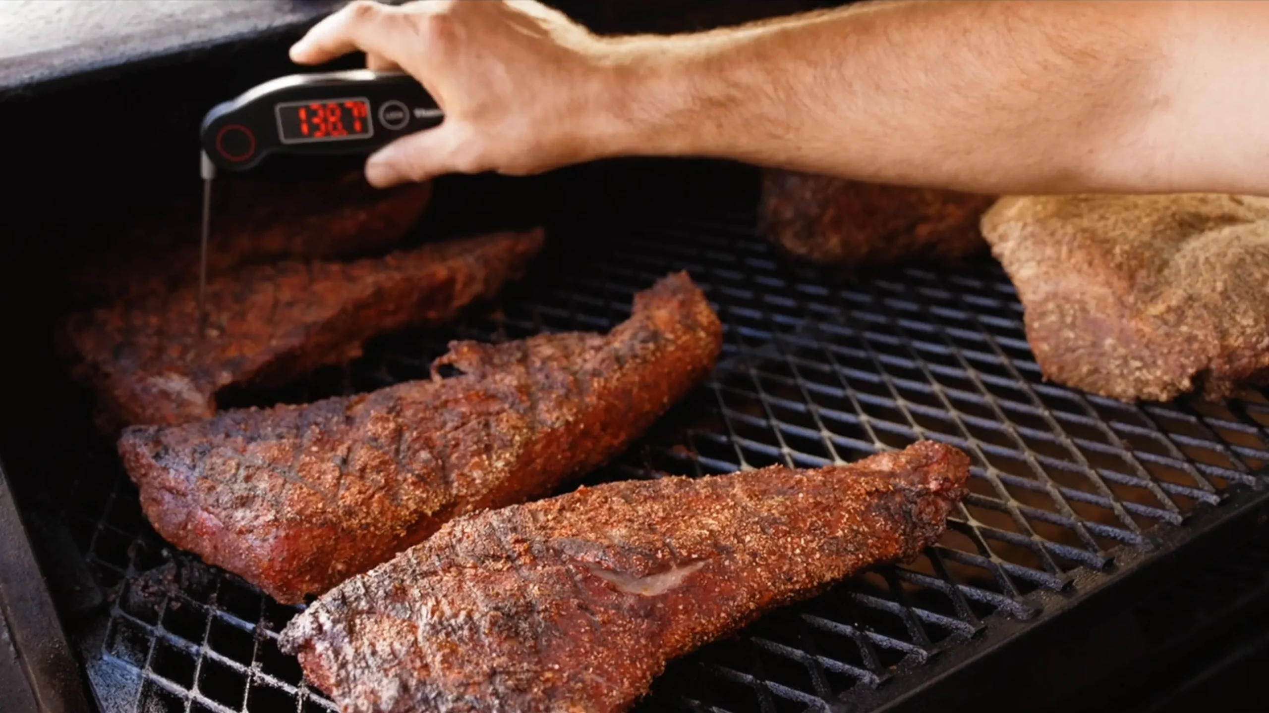 Seasoned American Wagyu tri-tips cooking on the grill